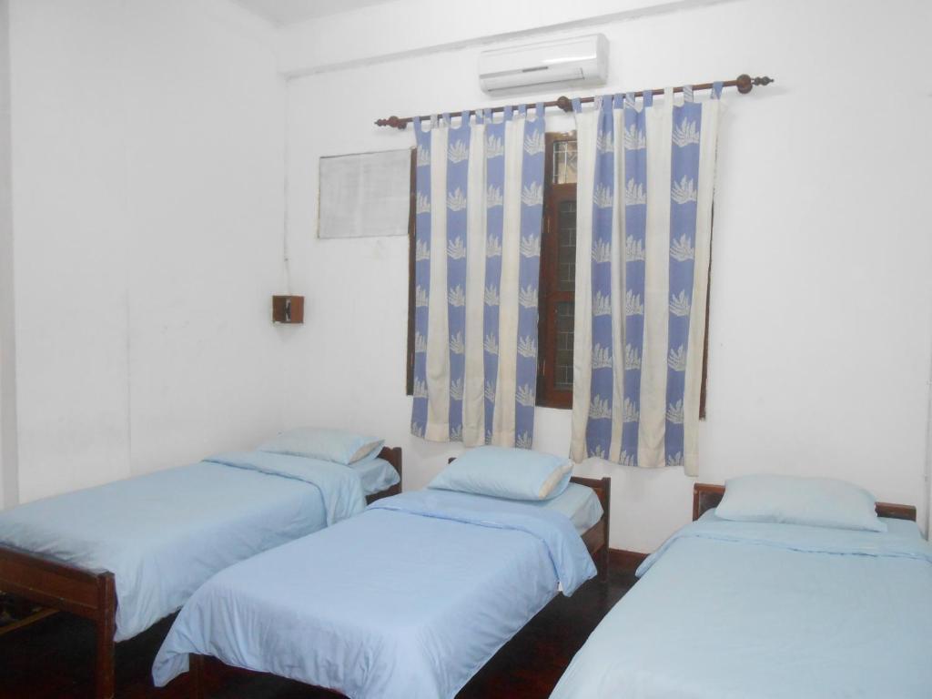 Saysouly Guesthouse Виентиане Стая снимка